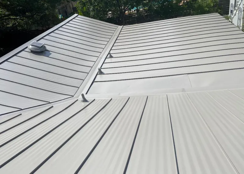Solar attic fan installed on a metal roof for Roof Ventilation in Nocatee